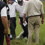 Angel Cabrera, right, of Argentina hugs Padraig Harrington of Ireland after Harrington found Cabrera's ball in the rough off the 18th hole during the first round of the U.S. Open Golf Championship at Bethpage State Park's Black Course in Farmingdale, N.Y., Friday, June 19, 2009. Play was suspended on Thursday because of inclement weather. (AP Photo/Morry Gash