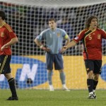 Spain's Xavi Alonso, left, Spain's Iker Casillas, center, and Spain's Carles Puyol, right, react after USA's Clint Dempsey scored his team's second goal during their Confederations Cup semifinal soccer match at Free State Stadium in Bloemfontein, South Africa, Wednesday, June 24, 2009. (AP Photo/Paul White)