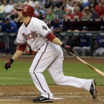 Arizona Diamondbacks' Mark Reynolds watches his two-run home run clear the fence against the Texas Rangers in the first inning of a baseball game Thursday, June 25, 2009, in Phoenix. (AP Photo/Ross D. Franklin)
