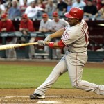 Los Angeles Angels' Maicer Izturis connects on a 2-run triple against the Arizona Diamondbacks in the second inning of a baseball game Friday, June 26, 2009, in Phoenix. (AP Photo/Ross D. Franklin)