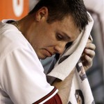 Arizona Diamondbacks' Billy Buckner wipes his face with a towel in the dugout after being pulled from the game after giving up eight run against the Los Angeles Angels in the second inning of a baseball game Friday, June 26, 2009, in Phoenix. (AP Photo/Ross D. Franklin)