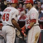 Los Angeles Angels' Torii Hunter (48) celebrates his home run against the Arizona Diamondbacks with teammate Bobby Abreu (53) in the second inning of a baseball game Friday, June 26, 2009, in Phoenix. (AP Photo/Ross D. Franklin)