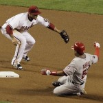 Los Angeles Angels' Bobby Abreu, right, slides safely into second base for a double, ahead of the tag by Arizona Diamondbacks' Felipe Lopez in the fourth inning of a baseball game Friday, June 26, 2009, in Phoenix. (AP Photo/Ross D. Franklin)