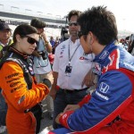IRL drivers Danica Patrick, left, talks with Hideki Mutoh, right, of Japan, prior to qualifying for the Suntrust Indy Challenge auto race at Richmond International Raceway in Richmond, Va., Friday, June 26, 2009. (AP Photo/Steve Helber)