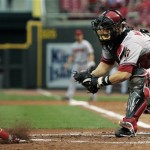 Arizona Diamondbacks catcher Miguel Montero, right, waits to tag out Cincinnati Reds' Danny Richar at home in the third inning of a baseball game, Wednesday, July 1, 2009, in Cincinnati. (AP Photo/Al Behrman)