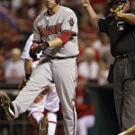 Arizona Diamondbacks Mark Reynolds tosses his bat after being struck out by Cincinnati Reds reliever David Weathers to end the eighth inning of a baseball game, Wednesday, July 1, 2009, in Cincinnati. Umpire Hunter Wendelstedt, right, calls the out. Cincinnati won the game 1-0. (AP Photo/Al Behrman)