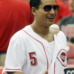 Actor Mario Lopez tosses a ball after throwing out a ceremonial first pitch prior to a baseball game between the Cincinnati Reds and Arizona Diamondbacks, Thursday, July 2, 2009, in Cincinnati. (AP Photo/Al Behrman)