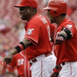 Cincinnati Reds manager Dusty Baker, left, and Willy Taveras argue a call in the first inning of a baseball game against the Arizona Diamondbacks, Thursday, July 2, 2009, in Cincinnati. Taveras was called out on a bunt attempt. (AP Photo/Al Behrman)