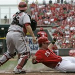 Arizona Diamondbacks catcher Miguel Montero (26) looks to first after stepping on home to force out Cincinnati Reds' Ryan Hanigan in the fourth inning of a baseball game, Thursday, July 2, 2009, in Cincinnati. Willy Taveras was safe at first after grounding to third with the bases loaded. (AP Photo/Al Behrman)