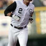 Colorado Rockies' Troy Tulowitzki circles the bases after hitting a solo home run against the Arizona Diamondbacks to lead off the second inning of a baseball game in Denver on Tuesday, July 21, 2009. (AP Photo/David Zalubowski)