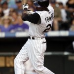 Colorado Rockies' Dexter Fowler follows through with his swing after connecting for an RBI-single against the Arizona Diamondbacks in the fourth inning of a baseball game in Denver on Tuesday, July 21, 2009. (AP Photo/David Zalubowski)