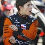 Danica Patrick describes her crash to crew members during a practice session for the IndyCar Series auto race in Edmonton, Alberta, Friday, July 24, 2009. (AP Photo/The Canadian Press, Jeff McIntosh)