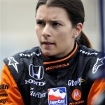 Driver Danica Patrick talks with her crew on pit road during practice for the Honda Indy 200 auto race at Mid Ohio Sports Car Course, Friday, Aug. 7, 2009, in Lexington, Ohio. (AP Photo/Tom E. Puskar)