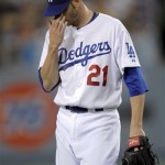 Los Angeles Dodgers starting pitcher Jon Garland walks off the field after giving up a run during the first inning of a baseball game against the Arizona Diamondbacks, Thursday, Sept. 3, 2009, in Los Angeles. (AP Photo/Gus Ruelas)