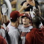 Arizona Diamondbacks' Stephen Drew celebrates his solo home-run in the dugout during the third inning of a baseball game against the Los Angeles Dodgers, Thursday, Sept. 3, 2009, in Los Angeles. (AP Photo/Gus Ruelas)