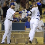 Los Angeles Dodgers' Manny Ramirez (99) celebrates his solo home-run with teammate Casey Blake, left, after crossing home-plate during the fourth inning of a baseball game against the Arizona Diamondbacks, Thursday, Sept. 3, 2009, in Los Angeles. (AP Photo/Gus Ruelas)