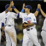 Los Angeles Dodgers' Ronnie Belliard (3), James Loney (7), Andre Ethier (16) and Jason Repko (17) celebrate their win over Arizona Diamondbacks at the end of ninth inning of a baseball game, Thursday, Sept. 3, 2009, in Los Angeles. The Dodgers won 4-2. (AP Photo/Gus Ruelas)