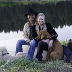 FILE - In this May 13, 2009 file photo originally released by WKT Public Relations, Patrick Swayze, left, and his wife Lisa Niemi pose with their dogs, poodle Lucas, left, and Rhodesian Ridgeback puppy Kumasai at their ranch in New Mexico. Swayze's publicist Annett Wolf says the 57-year-old "Dirty Dancing" actor died Monday, Sept. 14, 2009, after a nearly two-year battle with pancreatic cancer. (AP Photo/WKT Public Relations, Brian Braff)