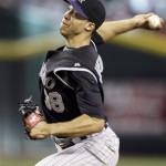 Colorado Rockies' Ubaldo Jimenez winds up to 
deliver a pitch against the Arizona 
Diamondbacks in the second inning of a baseball 
game Sunday, Sept. 20, 2009, in Phoenix. (AP 
Photo/Paul Connors)