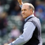 Chicago Cubs Hall of Famer Ryne Sandberg waves before throwing the ceremonial first pitch before a baseball game between the Arizona Diamondbacks and the Chicago Cubs in Chicago, Saturday, Oct. 3, 2009.(AP Photo/Nam Y. Huh)