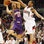 Phoenix Suns Steve Nash (13) shoots for the basketball as Portland Trail Blazers Brandon Roy (7) defends in the first quarter of their NBA preseason basketball game Wednesday, Oct. 14, 2009, in Portland, Ore. (AP Photo/Rick Bowmer)