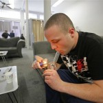 Samuel Bagdorf of San Francisco, who suffers from anxiety disorders, lights his marijuana pipe at the San Francisco Medical Cannabis Clinic in San Francisco, Monday, Oct. 19, 2009. Pot-smoking patients or their sanctioned suppliers should not be targeted for federal prosecution in states that allow medical marijuana, prosecutors were told Monday in a new policy memo issued by the Justice Department. Under the policy spelled out in a three-page legal memo, federal prosecutors are being told it is not a good use of their time to arrest people who use or provide medical marijuana in strict compliance with state law.(AP Photo/Eric Risberg)