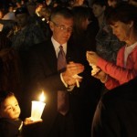 Army Secretary John McHugh, center, 
participates in a candle light vigil at Fort 
Hood, Texas, Friday, Nov. 6, 2009. (AP Photo/LM 
Otero)