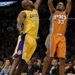 Phoenix Suns forward Grant Hill (33) shoots over Los Angeles Lakers forward Lamar Odom, left, in the first half of a NBA basketball game, Thursday, Nov. 12, 2009, in Los Angeles. (AP Photo/Gus Ruelas)