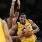 Los Angeles Lakers center Andrew Bynum (17) drives on Phoenix Suns center Channing Frye (8) in the first half of a NBA basketball game, Thursday, Nov. 12, 2009, in Los Angeles. (AP Photo/Gus Ruelas)