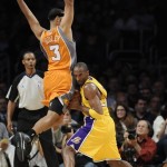 Los Angeles Lakers guard Kobe Bryant (24) fakes Phoenix Suns forward Jared Dudley (3) off his feet in the first half of a NBA basketball game, Thursday, Nov. 12, 2009, in Los Angeles. (AP Photo/Gus Ruelas)