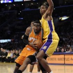 Phoenix Suns forward Amare Stoudemire (1) gets around Los Angeles Lakers center Andrew Bynum, right, in the first half of a NBA basketball game, Thursday, Nov. 12, 2009, in Los Angeles. (AP Photo/Gus Ruelas)