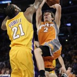 Phoenix Suns guard Goran Dragic (2), of Slovenia, has his shot blocked by Los Angeles Lakers center Josh Powell (21) in the first half of a NBA basketball game, Thursday, Nov. 12, 2009, in Los Angeles. (AP Photo/Gus Ruelas)