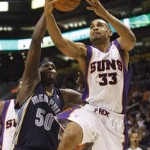Phoenix Suns' Grant Hill (33) shoots over Memphis Grizzlies' Zach Randolph (50) during the third quarter of an NBA basketball game Wednesday, Nov. 25, 2009, in Phoenix. (AP Photo/Matt York)