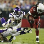 Vikings E.J. Henderson(56) collides with teammate Jamarca Sanford while trying to tackle Arizona's Tim Hightower in the fourth quarterof the NFL football game Sunday, Dec. 6, 2009 in Glendale, Ariz. Henderson was taken off the field on a cart. (AP Photo/Jerry Holt/The Star Tribune)