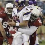 Minnesota Vikings' Brett Favre (4) gets sacked by Arizona Cardinals' Bertrand Berry, right, in the fourth quarter during an NFL football game Sunday, Dec. 6, 2009, in Glendale, Ariz. The Cardinals defeated the Vikings 30-17. (AP Photo/Ross D. Franklin)