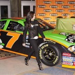 IndyCar driver Danica Patrick checks out her new GoDaddy.com No. 7 JR Motorsports stock car during an event announcing her intention to make her stock car racing debut in an ARCA race Tuesday, Dec. 8, 2009, in Phoenix. Patrick has signed with JR Motorsports team, owned by Dale Earnhardt Jr. and Rick Hendrick, and intends to start in her first in an ARCA Series race on Feb. 6 at Daytona International Speedway. (AP Photo/Ross D. Franklin)