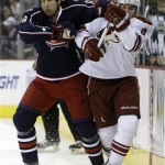 Columbus Blue Jackets' R.J. Umberger, left, and Phoenix Coyotes' Scottie Upshall fight for a loose puck during the first period of an NHL hockey game Thursday, Dec. 17, 2009, in Columbus, Ohio. (AP Photo/Jay LaPrete)