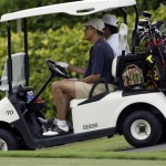 President Barack Obama, left, drives a golf cart with fellow player Mike Ramos during a game at Mid Pacific Country Club in Kailua, Hawaii Thursday, Dec. 31, 2009. The Obamas are in Hawaii for the holidays. (AP Photo/Alex Brandon)