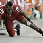 Arizona Cardinals cornerback Dominique Rodgers-Cromartie stretches on the sidelines after returning from a first-quarter knee injury during an NFL football game against the Green Bay Packers on Sunday, Jan. 3, 2010, in Glendale, Ariz. (AP Photo/Paul Connors)
