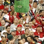 An Arizona Cardinals fans holds a sign saying "See ya next week" during the first half on the Cardinals' NFL football game against the Green Bay Packers on Sunday, Jan. 3, 2010, in Glendale, Ariz., in reference to the Packers possibly returning to Arizona for a playoff game next week. (AP Photo/Matt York)