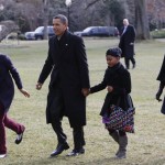 President Barack Obama, first lady Michelle Obama, and daughters Malia and Sasha return to the White House in Washington, Monday, Jan. 4, 2010, after their vacation in Hawaii. Malia is sprinting ahead to greet the family dog, Bo, inside the Executive Mansion. (AP Photo/Charles Dharapak)