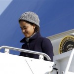 Malia Obama, 11, daughter of President Barack Obama, steps off Air Force One at Andrews Air Force Base, Md., Monday, Jan. 4, 2010, as the Obama family returned after spending the holidays in Hawaii. (AP Photo/Alex Brandon)