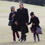 President Barack Obama walks with his daughters Malia and Sasha as they return to the White House in Washington, Monday, Jan. 4, 2010, after their vacation in Hawaii. (AP Photo/Charles Dharapak)