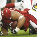 Arizona Cardinals' Alan Branch (78) recovers a Green Bay Packers fumble in front of Packers' Greg Jennings (85) during the first half of an NFL wild-card playoff football game Sunday, Jan. 10, 2010, in Glendale, Ariz. (AP Photo/Matt York)