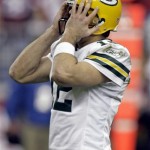 Green Bay Packers' Aaron Rodgers reacts after being sacked during the first half of an NFL wild-card playoff football game against the Arizona Cardinals on Sunday, Jan. 10, 2010, in Glendale, Ariz. (AP Photo/Paul Connors)