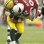 Green Bay Packers quarterback Aaron Rodgers is sacked by Arizona Cardinals' Bertrand Berry (92) during the first half of an NFL wild-card playoff football game Sunday, Jan. 10, 2010, in Glendale, Ariz. (AP Photo/Matt York)