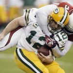 Green Bay Packers quarterback Aaron Rodgers is sacked by Arizona Cardinals' Bertrand Berry (92) during the first half of an NFL wild-card playoff football game Sunday, Jan. 10, 2010, in Glendale, Ariz. (AP Photo/Paul Connors)