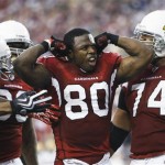 Arizona Cardinals' Early Doucet (80) celebrates after catching a 15-yard touchdown pass during the first half of an NFL wild-card playoff football game against the Green Bay Packers on Sunday, Jan. 10, 2010, in Glendale, Ariz. (AP Photo/Matt York)