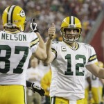 Green Bay Packers quarterback Aaron Rodgers (12) gives a thumbs-up to wide receiver Jordy Nelson (87) after Nelson caught a 10-yard touchdown pass during the second half of an NFL wild-card playoff football game against the Arizona Cardinals on Sunday, Jan. 10, 2010, in Glendale, Ariz. (AP Photo/Ross D. Franklin)