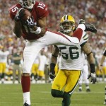 Arizona Cardinals' Steve Breaston (15) catches a 17-yard touchdown pass in front of Green Bay Packers' Nick Barnett (56) during the second half of an NFL wild-card playoff football game Sunday, Jan. 10, 2010, in Glendale, Ariz. (AP Photo/Matt York)